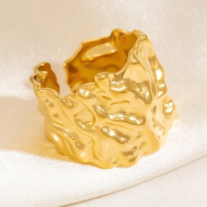 Irregular textured 18K gold stainless steel open ring with lava fold design on silk