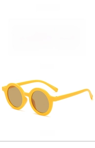 Detail view showing front and side of yellow round sunglasses for kids with UV protection