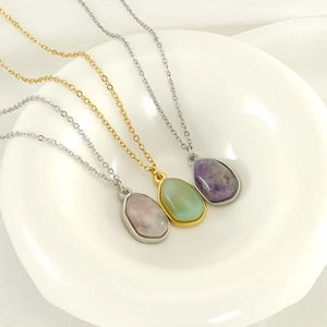 Three irregular natural stone teardrop necklaces in silver and gold stainless steel