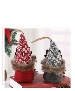 Detail of Nordic Christmas gnome hanging ornaments with knit hats and reindeer antlers