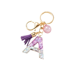 Letter A keychain with purple holographic sequins, gold ring and purple tassel pendant