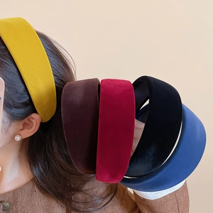 Detailed view of thick velvet headbands in multiple colors for high top styling