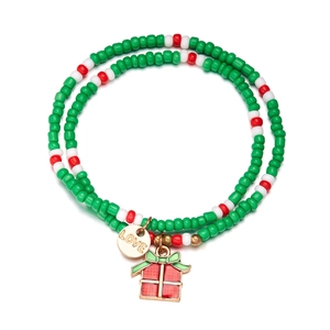 Detailed view of Christmas beaded bracelet with red green beads and LOVE charm