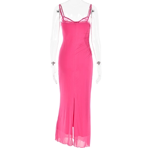 Close-up of pink slim fit dress featuring lace patchwork and high side slit detail