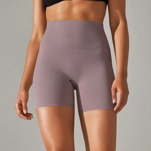 Detail of high waisted yoga shorts showing seamless lilac fabric and tummy control fit