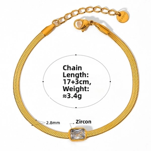Detail of gold snake chain bracelet with square zircon and lobster clasp closure