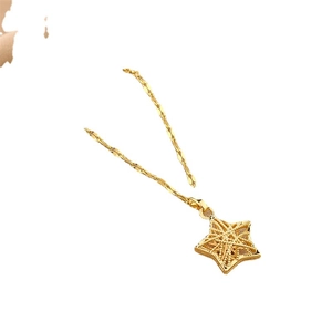 Minimalist gold hollow star pendant necklace with fine twisted chain on white background