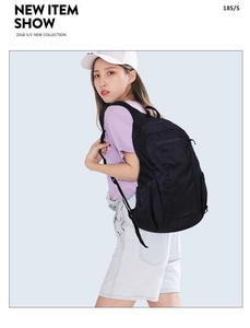 Detail view of lightweight black waterproof backpack with large capacity and side pockets