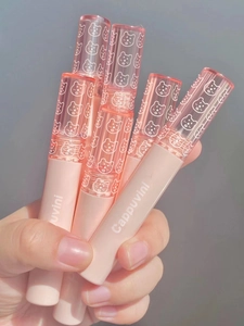 Close-up of pink Cappuvini lip glaze tubes featuring white bear patterns and clear caps