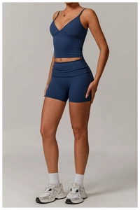 Detail of high-stretch eco-friendly recycled deep V-neck sports tank top and biker shorts
