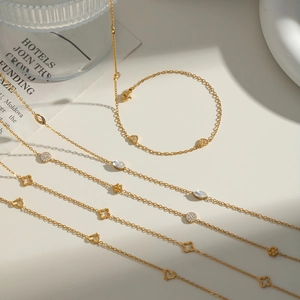 Elegant 18K gold plated titanium steel necklaces and bracelets with heart and clover charms
