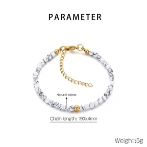 Macro shot of white marble beads bracelet with gold-tone extension chain and lobster clasp