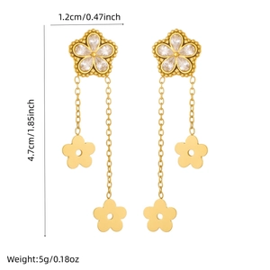 Polished gold floral tassel earrings with sparkling crystals and long chain drops