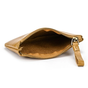 Detailed view of the internal compartment and vintage metal zipper of the leather coin purse
