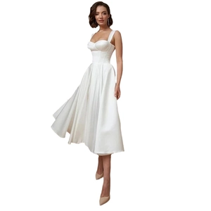 Elegant white satin midi bridal dress with wide straps and corset bodice on white background