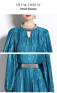 Detailed view of beaded high neck and pleated satin fabric on peacock blue dress