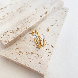 Macro shot of 18k gold plated spiral ring featuring two brilliant round cubic zirconia stones