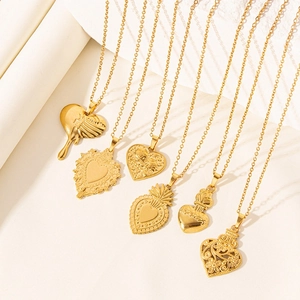 Set of six gold heart pendants in 18k plated stainless steel with various textures