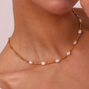 Close-up of handmade 18K gold plated stainless steel necklace with fresh water pearls
