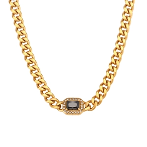 Gold Cuban link necklace with black rectangular gemstone and clear zircon accents