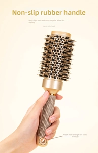 Detail of professional gold round hair brush with ergonomic non-slip rubber handle