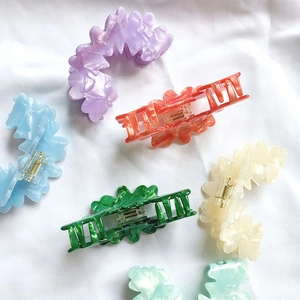 Molletoni per capelli francesi in acetato a fiori ondulati in vari colori marmorizzati