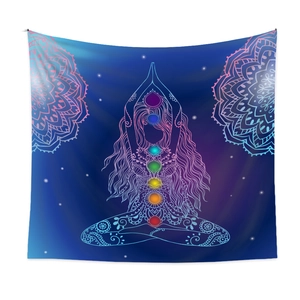 Detail of blue chakra yoga tapestry featuring rainbow symbols and mandala patterns
