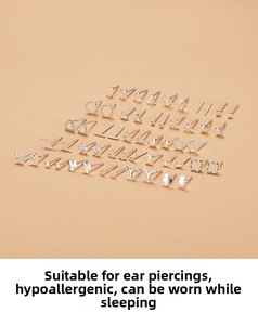 Detailed view of S999 silver stud earring set with diverse geometric shapes and patterns
