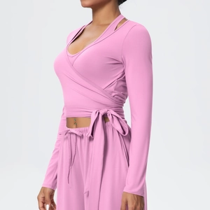 Pink V-neck cross strap wrap top with matching joggers for yoga and fitness training