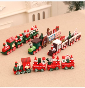 Detailed view of four festive wooden Christmas trains with snowmen and reindeer ornaments