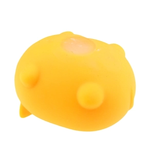 Close-up of yellow squishy Shiba Inu stress toy back showing soft silicone material