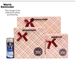 Close-up of three pink plaid gift bags with satin bows and brown rope handles
