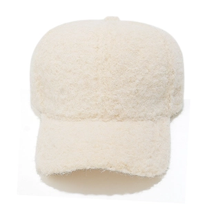 Close-up of soft fuzzy faux mohair texture on cream winter baseball cap for outdoor warmth