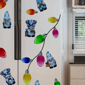 Close-up of blue Christmas gnomes and colorful light bulb magnetic stickers on a fridge