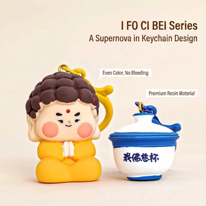 Creative Buddha resin keychain set with monk doll and tea cup pendant on beige background