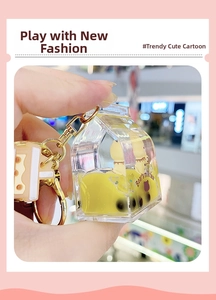 Close-up of Bear's milk tea liquid keychain with floating bears and pearls inside