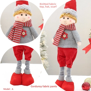 Detail showing red snowflake buttons and knitted texture of the Christmas doll outfit
