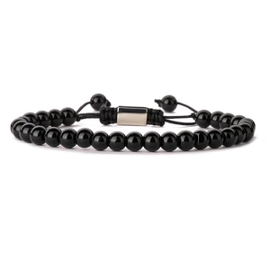 Close-up of a woven black obsidian bead bracelet with durable knotted rope and metal clasp