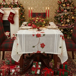 Christmas tablecloth with red poinsettia embroidery and scalloped lace edges