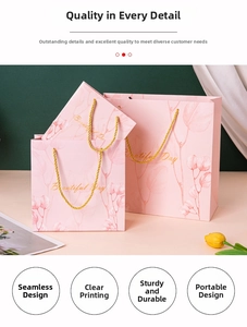 Detail of pink gift bag with gold woven handles and floral Beautiful Day text
