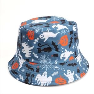 Detail of Halloween bucket hat with pumpkin, ghost, and bat prints on navy fabric