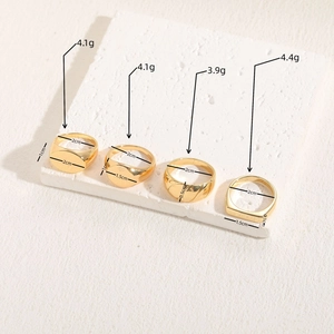 Set of four geometric 14K gold plated rings including signet and textured dome styles