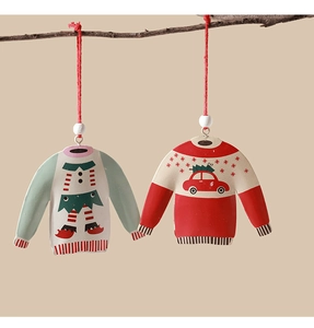 Christmas tin sweater ornaments in red and mint green with wooden beads on tree branches