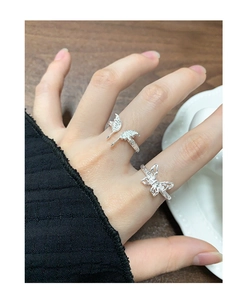 Macro detail of S925 sterling silver butterfly ring set with textured hollow wings