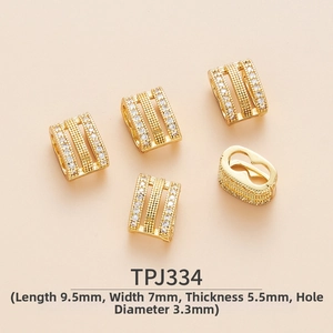 Macro shot of 9.5mm gold-plated brass spacer beads with micro-pave cubic zirconia rows