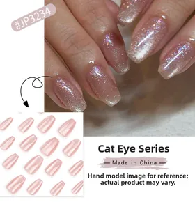 Macro detail of champagne cat eye press-on nails with sparkling magnetic pearl finish