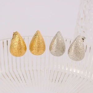 Textured teardrop stud earrings in gold and silver finish, 18K plated stainless steel