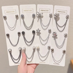 Detailed set of 12 elegant brooch pins with pearls, stars, and heart decorative elements