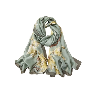 Elegant sage green satin scarf with magnolia floral print and dark gray border