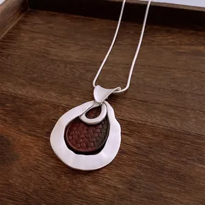 Vintage style pleated teardrop pendant necklace with silver chain and woven texture